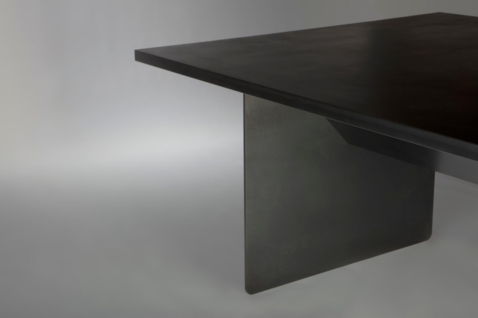 https://a.1stdibscdn.com/large-deep-black-steel-dining-table-for-sale-picture-4/f_53662/f_199464821595361476841/01_APD_Marianas_Table_002_1__master.jpg