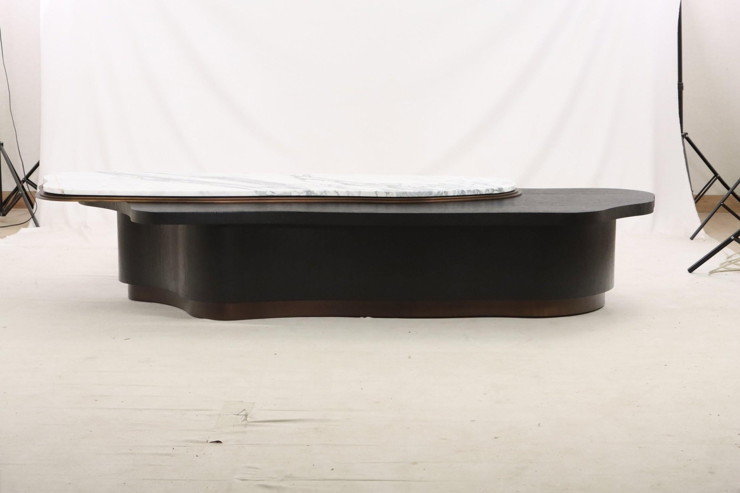 https://a.1stdibscdn.com/87-long-custom-amorphous-coffee-table-in-dark-marble-with-dark-stained-oak-for-sale-picture-6/f_27693/f_492185321773439508954/0ae3122b_113a_449c_9ca2_cfd7b1e36894_master.jpg