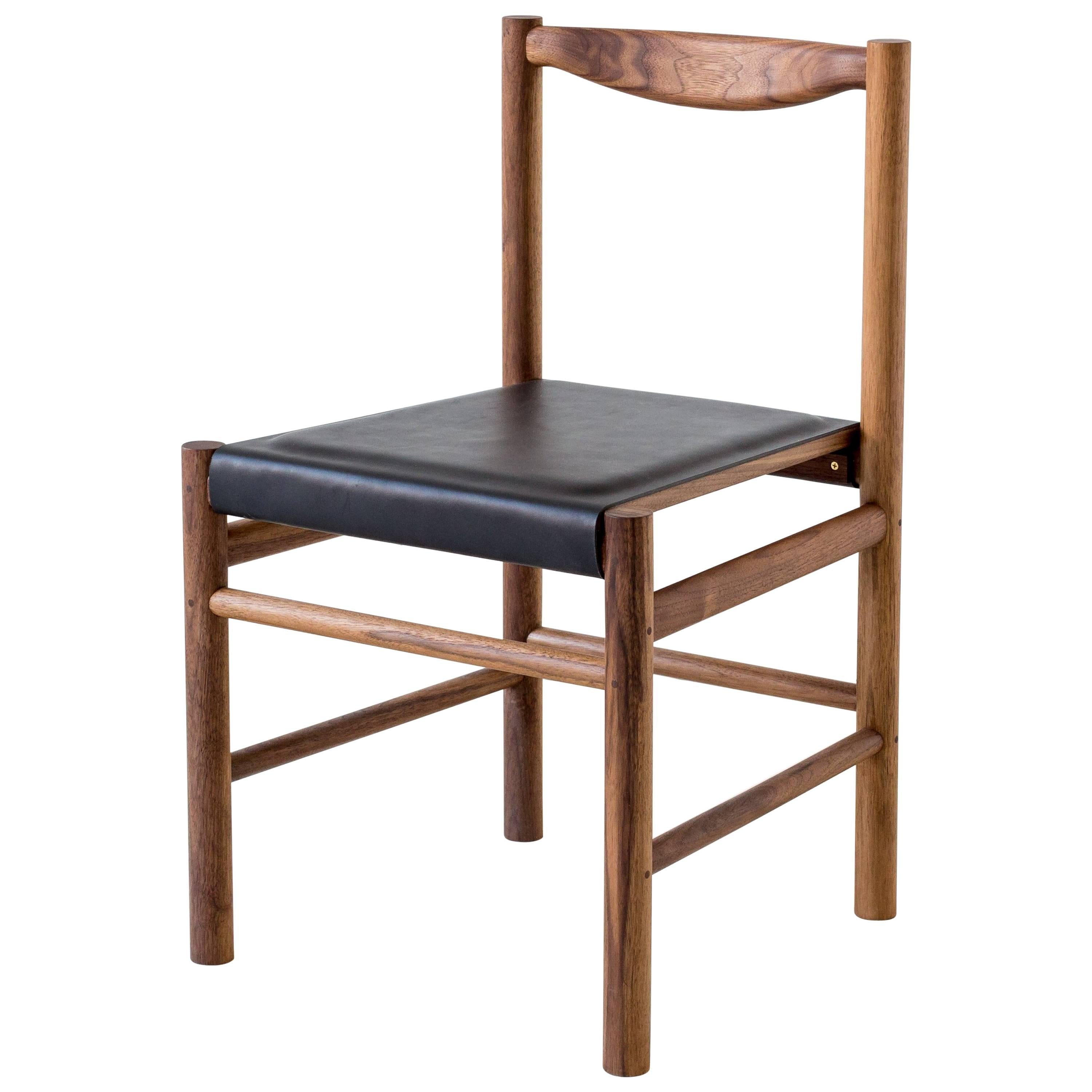 https://a.1stdibscdn.com/range-dining-chair-in-walnut-and-leather-by-fort-standard-for-sale/1121189/f_105194831524907840679/10519483_master.jpg