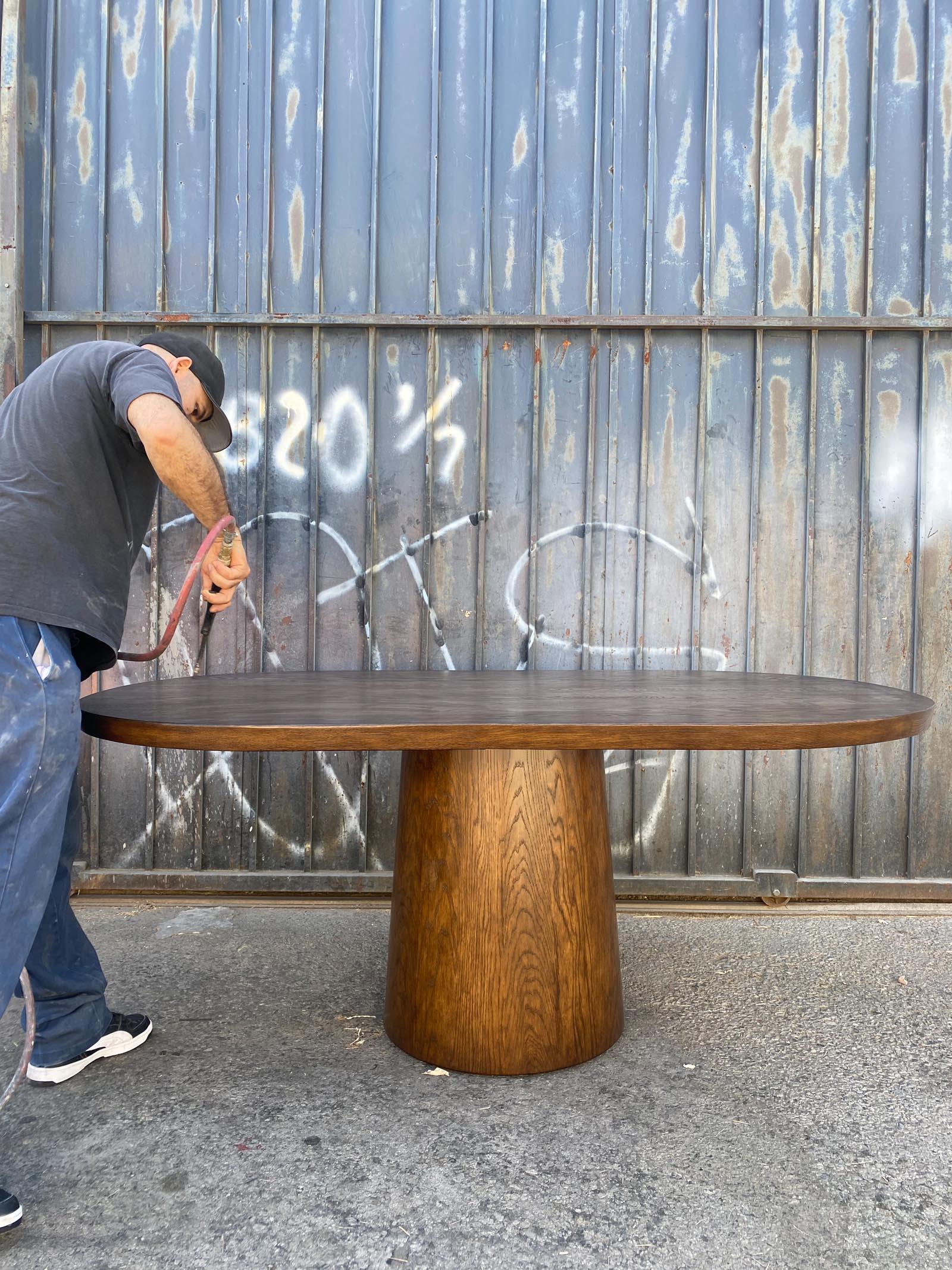 https://a.1stdibscdn.com/dos-gallos-custom-oak-oval-top-table-with-tapered-base-for-sale-picture-13/f_7978/f_404113621719781173846/10_32InActionInsta_master.jpg