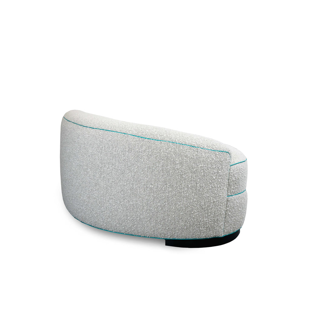 https://a.1stdibscdn.com/boucle-curved-sofa-with-turquoise-accents-for-sale-picture-6/f_21233/1622750901627/10_master.jpg