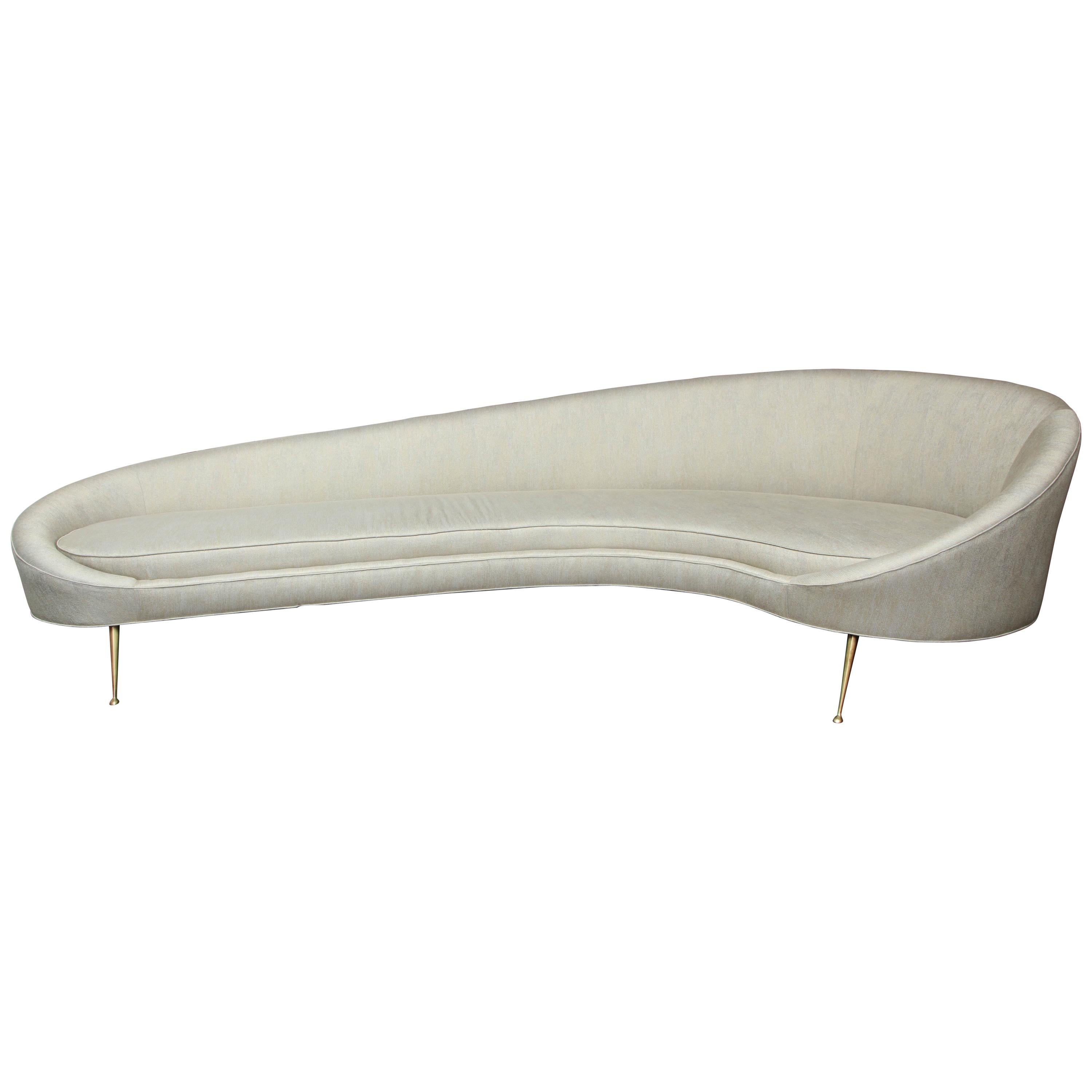 https://a.1stdibscdn.com/elegant-curved-sofa-in-custom-upholstery-with-brass-legs-for-sale/1121189/f_118762311537528283303/11876231_master.jpg