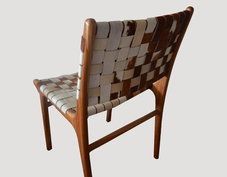 https://a.1stdibscdn.com/andrianna-shamaris-premium-double-backed-teak-wood-cowhide-chair-for-sale-picture-2/f_10806/f_365604221697038509612/11_master.jpg?width=768