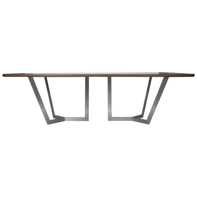 https://a.1stdibscdn.com/modern-dining-room-table-with-wooden-top-and-stainless-finished-legs-for-sale/1121189/f_130841211545307794593/13084121_master.jpg?width=768