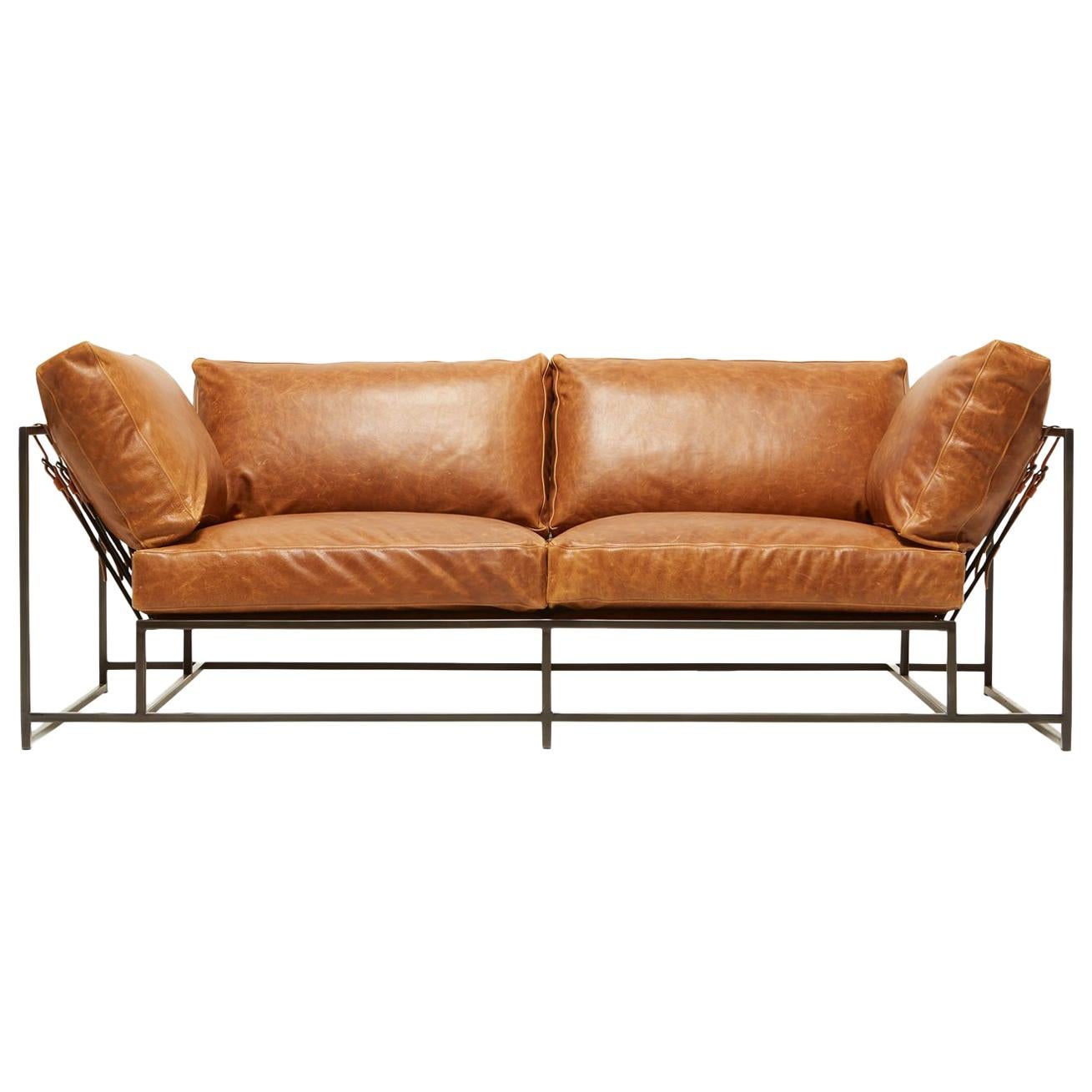 https://a.1stdibscdn.com/potomac-tan-leather-and-blackened-steel-two-seat-sofa-for-sale/1121189/f_133586311547818297960/13358631_master.jpg
