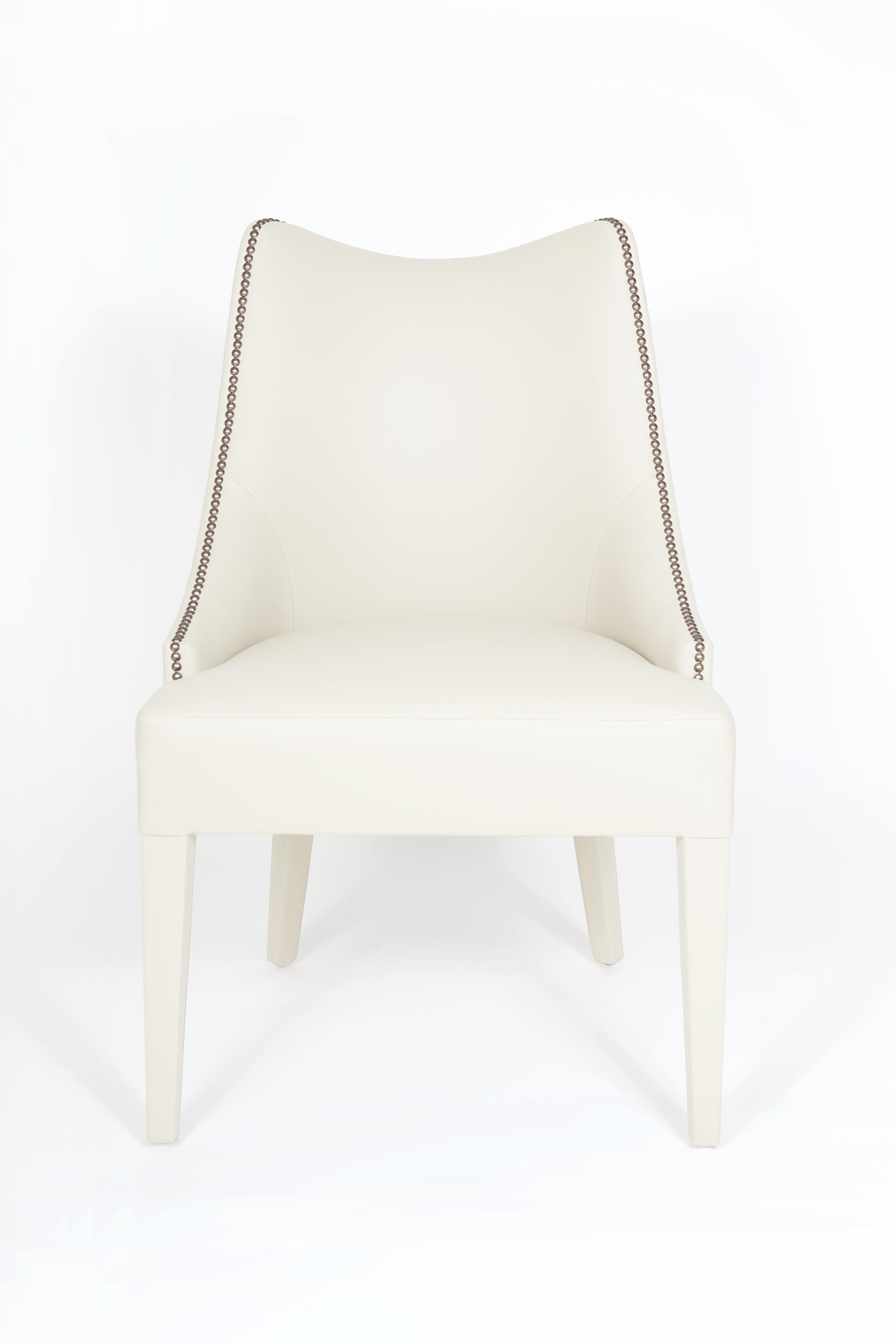 https://a.1stdibscdn.com/modern-classic-dining-chairs-with-nail-trim-detailing-by-munna-design-for-sale-picture-5/f_27693/f_392387321712877433924/151100_MUNNA_Becomes_Me_Dining_Chair_ORIGINAL_1__master.jpg