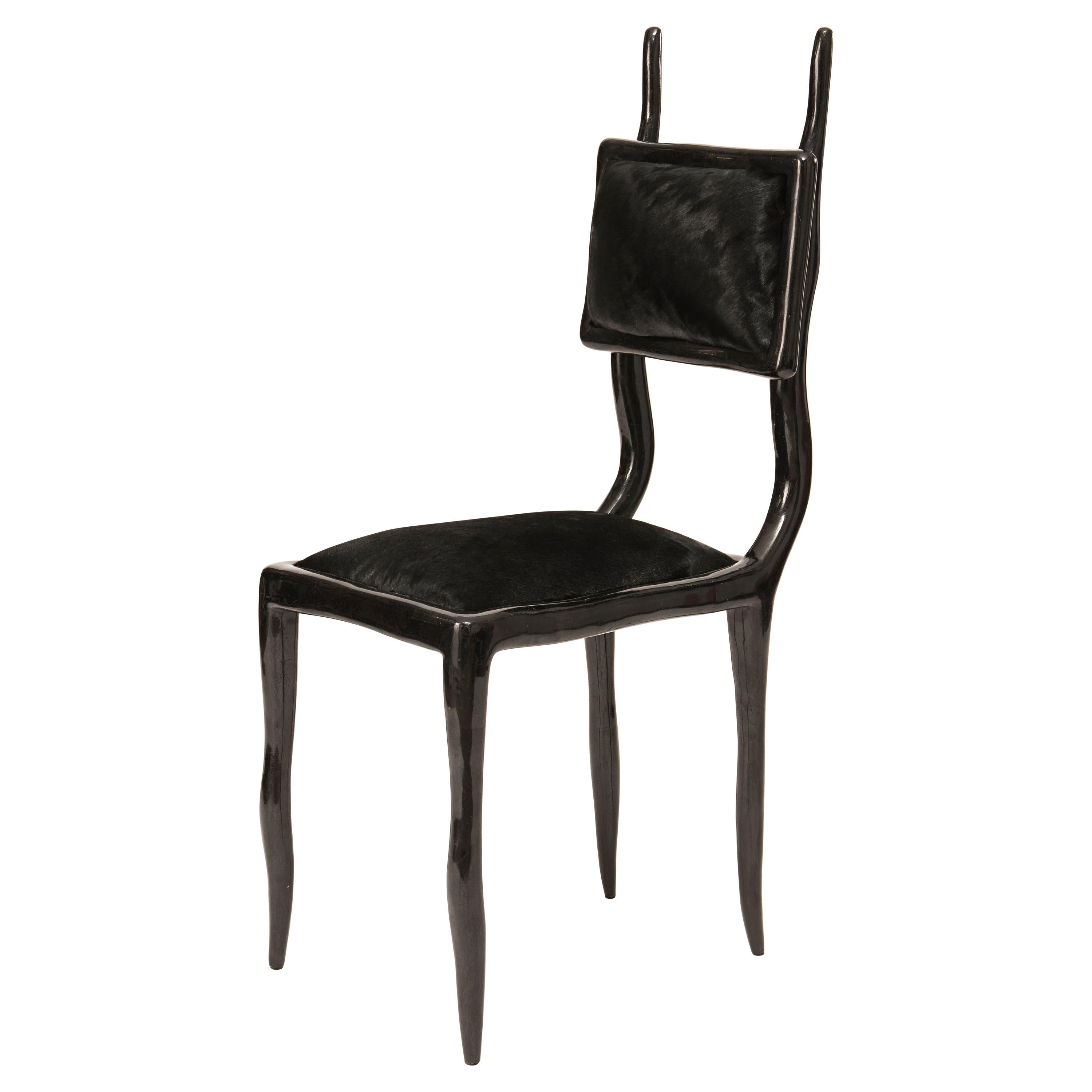 https://a.1stdibscdn.com/eden-chair-in-black-pen-shell-and-upholstered-in-calf-hair-by-ry-augousti-for-sale/1121189/f_153082411562573645379/15308241_master.jpg