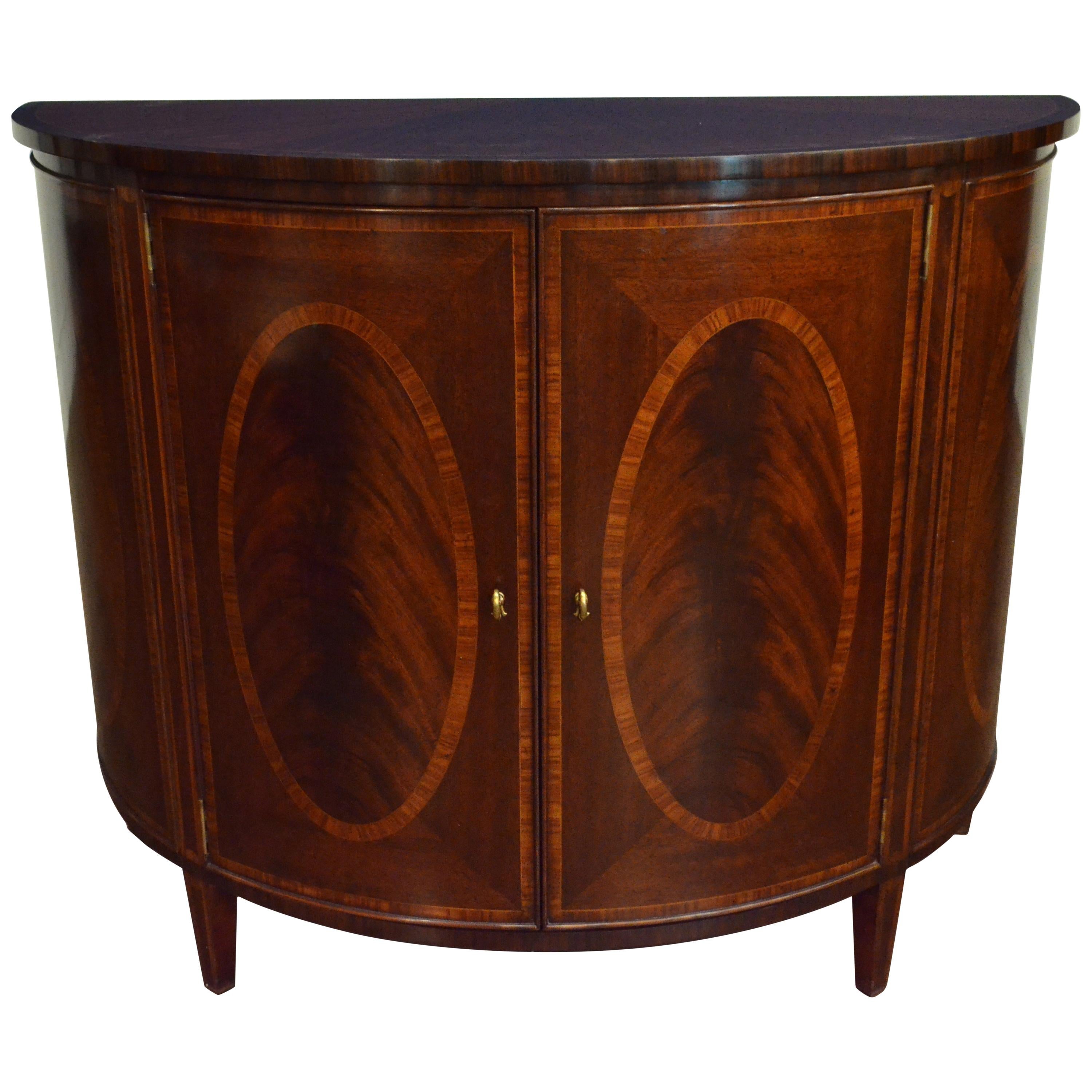 https://a.1stdibscdn.com/hepplewhite-style-mahogany-demilune-cabinet-by-leighton-hall-for-sale/1121189/f_154696221563252740750/15469622_master.jpeg
