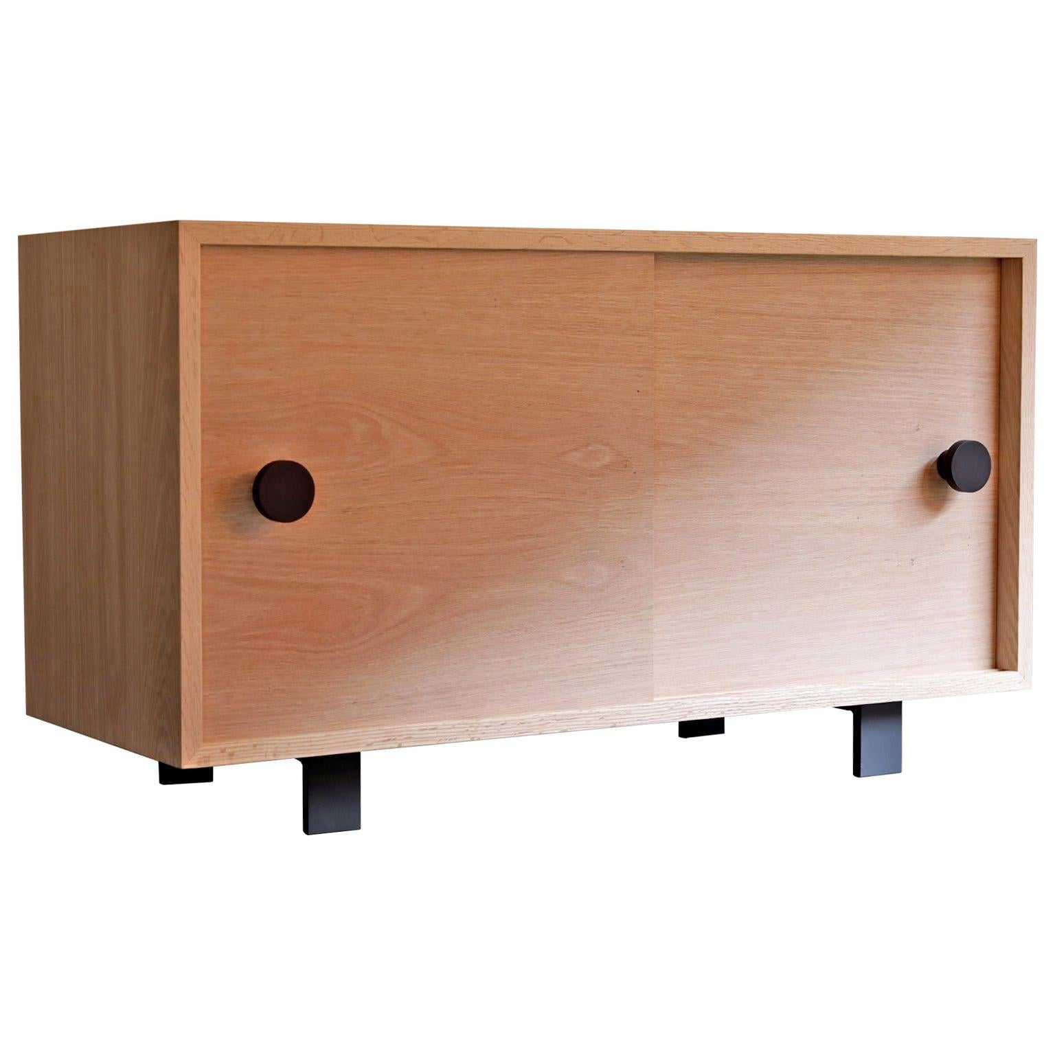 https://a.1stdibscdn.com/aquinas-red-oak-sliding-door-cabinet-for-sale/1121189/f_160594721568081615277/16059472_master.jpg