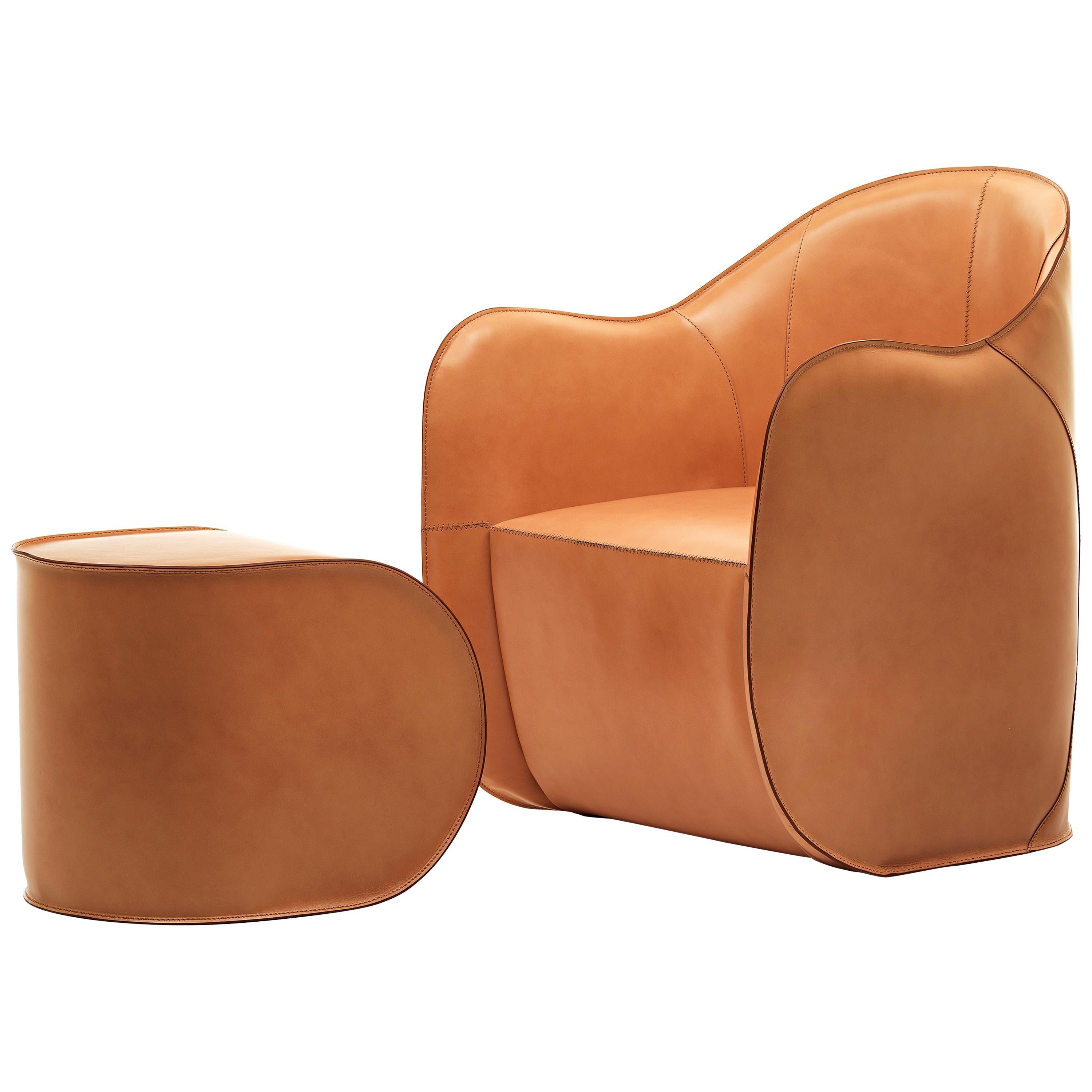 https://a.1stdibscdn.com/exo-armchair-and-pouf-set-for-sale/1121189/f_161783121569660010069/16178312_master.jpg