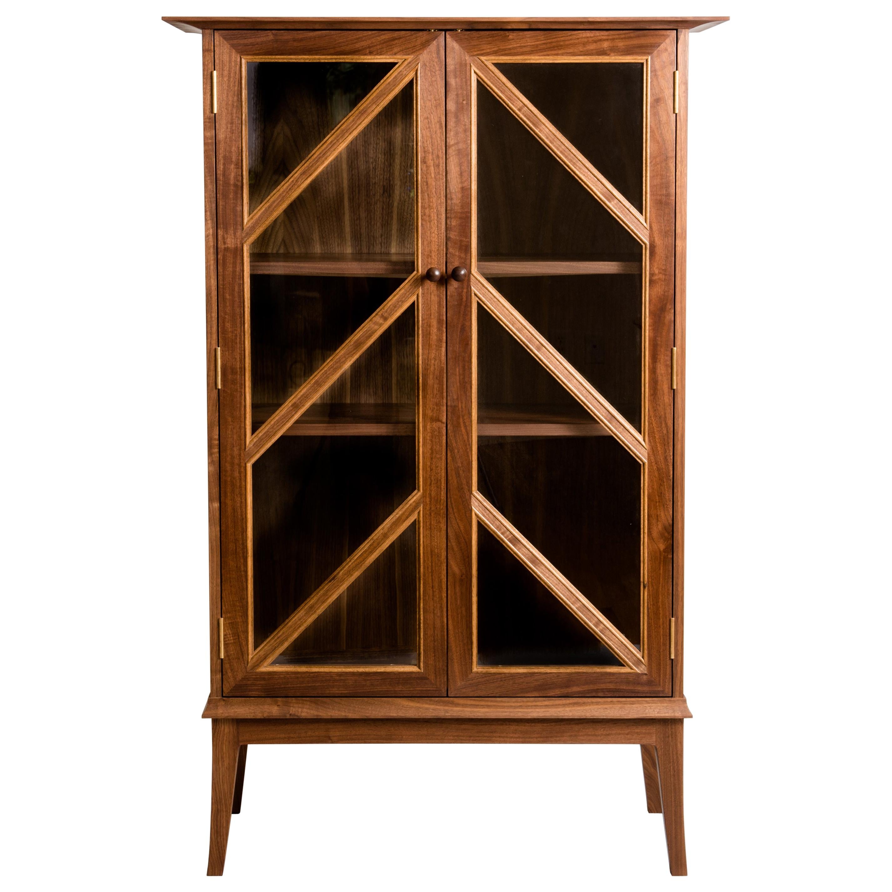 https://a.1stdibscdn.com/tall-contemporary-walnut-cabinet-with-glass-doors-and-butternut-details-for-sale/1121189/f_164999621571411407222/16499962_master.jpg