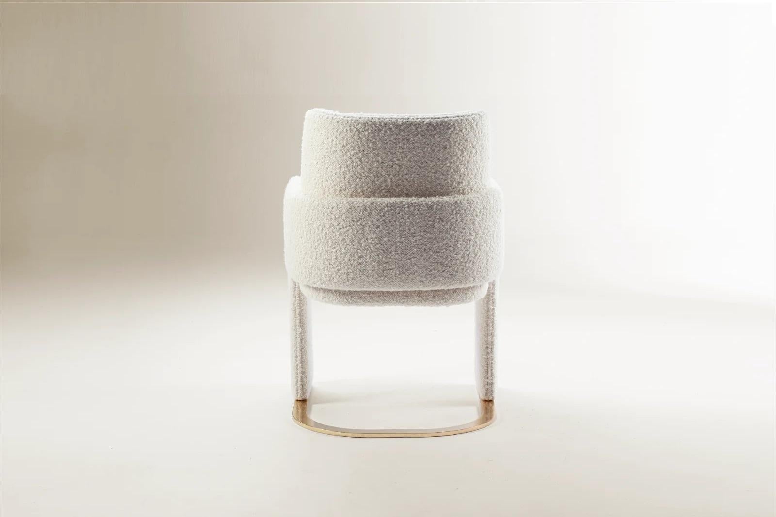 https://a.1stdibscdn.com/dooq-dining-chair-odisseia-with-off-white-boucle-and-brass-for-sale-picture-4/f_54242/f_350726321688467757834/1677520213580_312_master.jpg