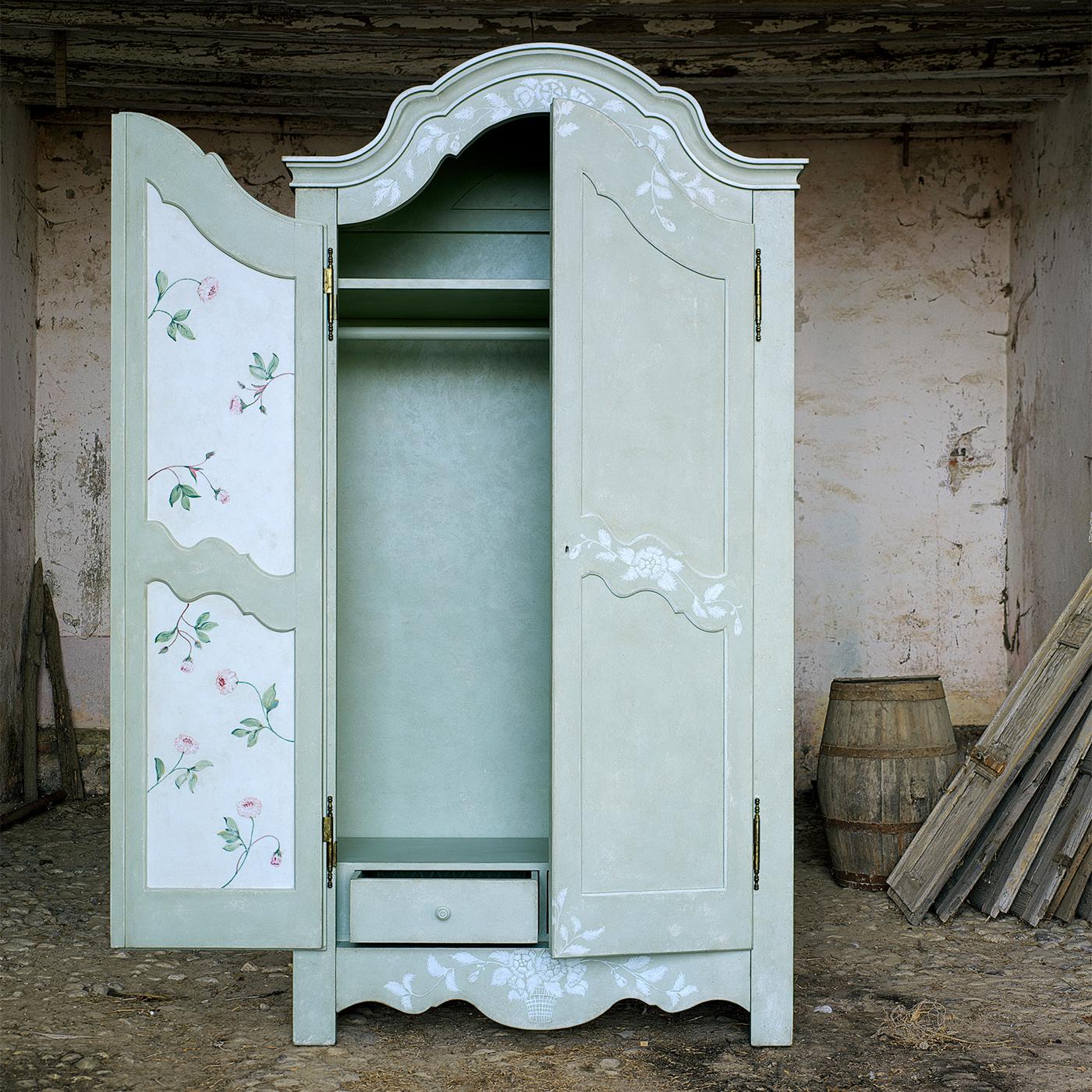 https://a.1stdibscdn.com/blue-mantegna-armoire-with-textural-white-flowers-for-sale-picture-2/f_17062/f_352315621689346162390/1688391926338_ASTMNY_0043_Mantegna_Armoire_1__master.jpg