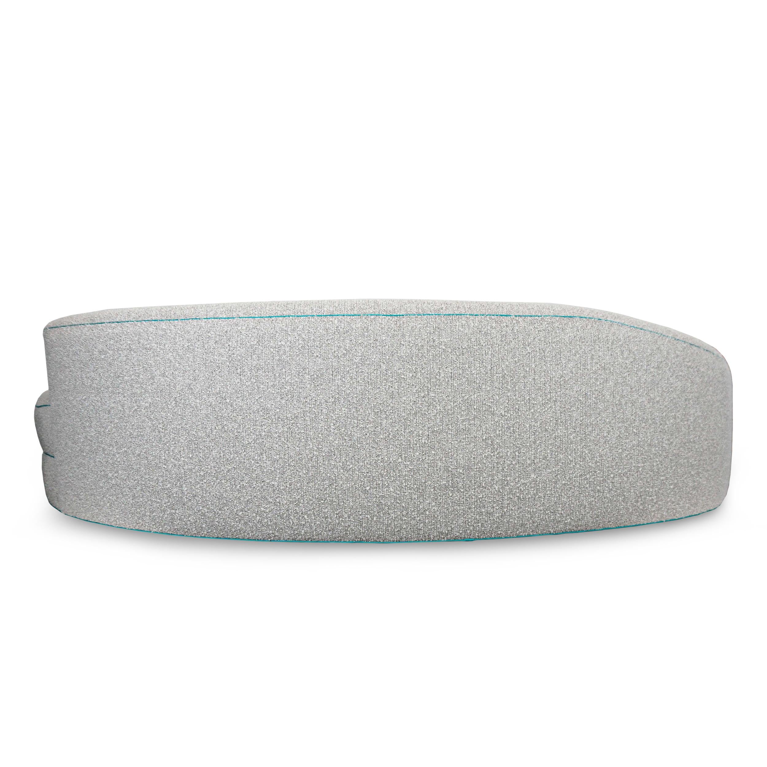 https://a.1stdibscdn.com/boucle-curved-sofa-with-turquoise-accents-for-sale-picture-12/f_21233/1622750909532/16_master.jpg