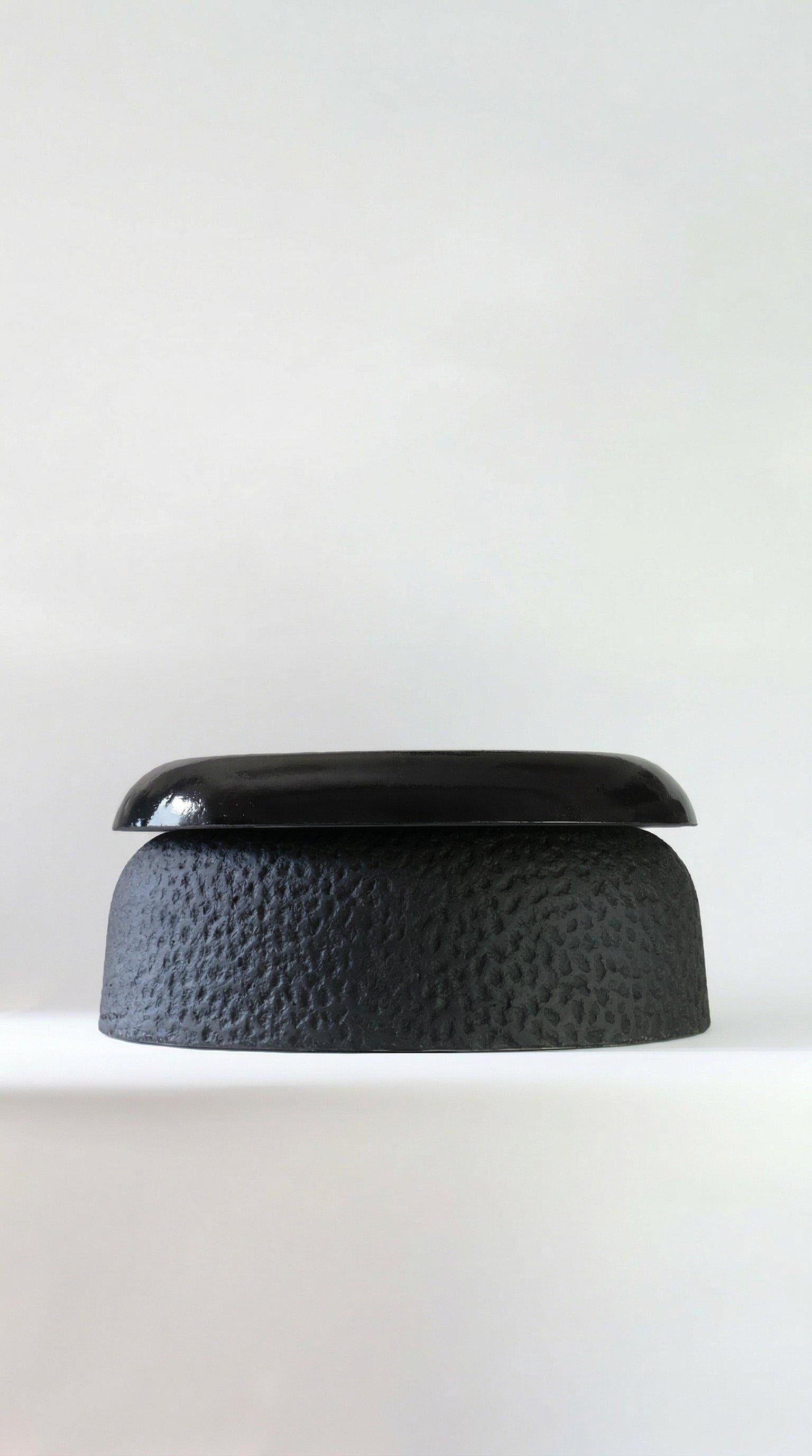 https://a.1stdibscdn.com/handcrafted-oval-black-cast-stone-coffee-table-by-alentes-atelier-greece-for-sale-picture-2/f_56452/f_495613821775577211409/16x9_STRAWBERRY_TABLE_AI_1__master.jpeg
