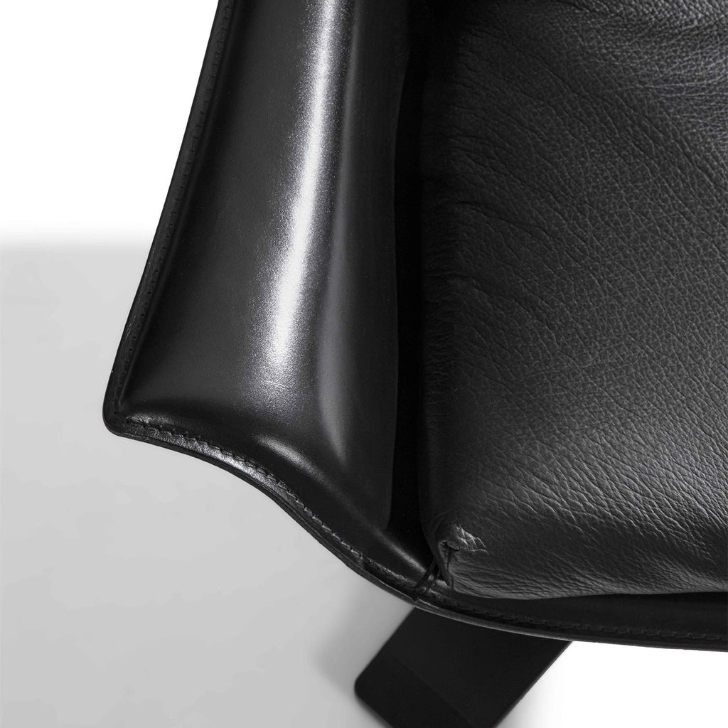 https://a.1stdibscdn.com/lullaby-black-leather-swivel-armchair-for-sale-picture-8/f_17062/f_495869821775726431135/1773394461781_RMSENY_0021_32A28955588_1_1__master.jpg