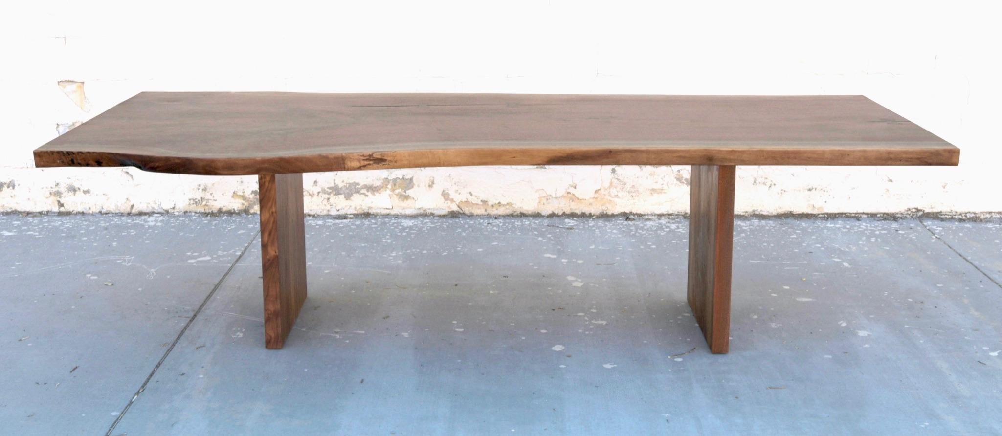 https://a.1stdibscdn.com/walnut-slab-live-edge-dining-table-custom-made-by-petersen-antiques-for-sale-picture-3/f_8065/1597847482538/1A9E16AF_66EE_4985_8936_F40193128026_master.jpeg