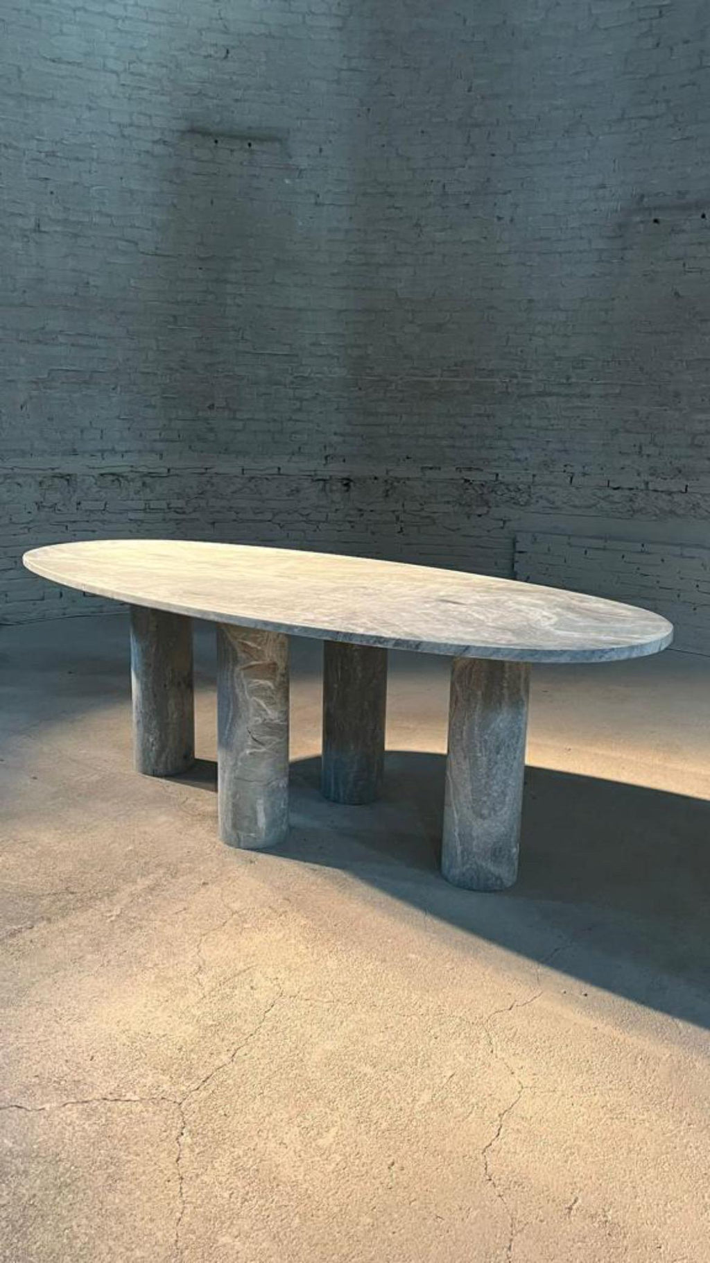 https://a.1stdibscdn.com/large-solid-stone-green-marble-oval-dining-table-with-bellini-style-column-legs-for-sale-picture-2/f_80522/f_324225721675952087471/1B6373E2_8807_4A1F_996F_7847C9198ED2_master.JPG