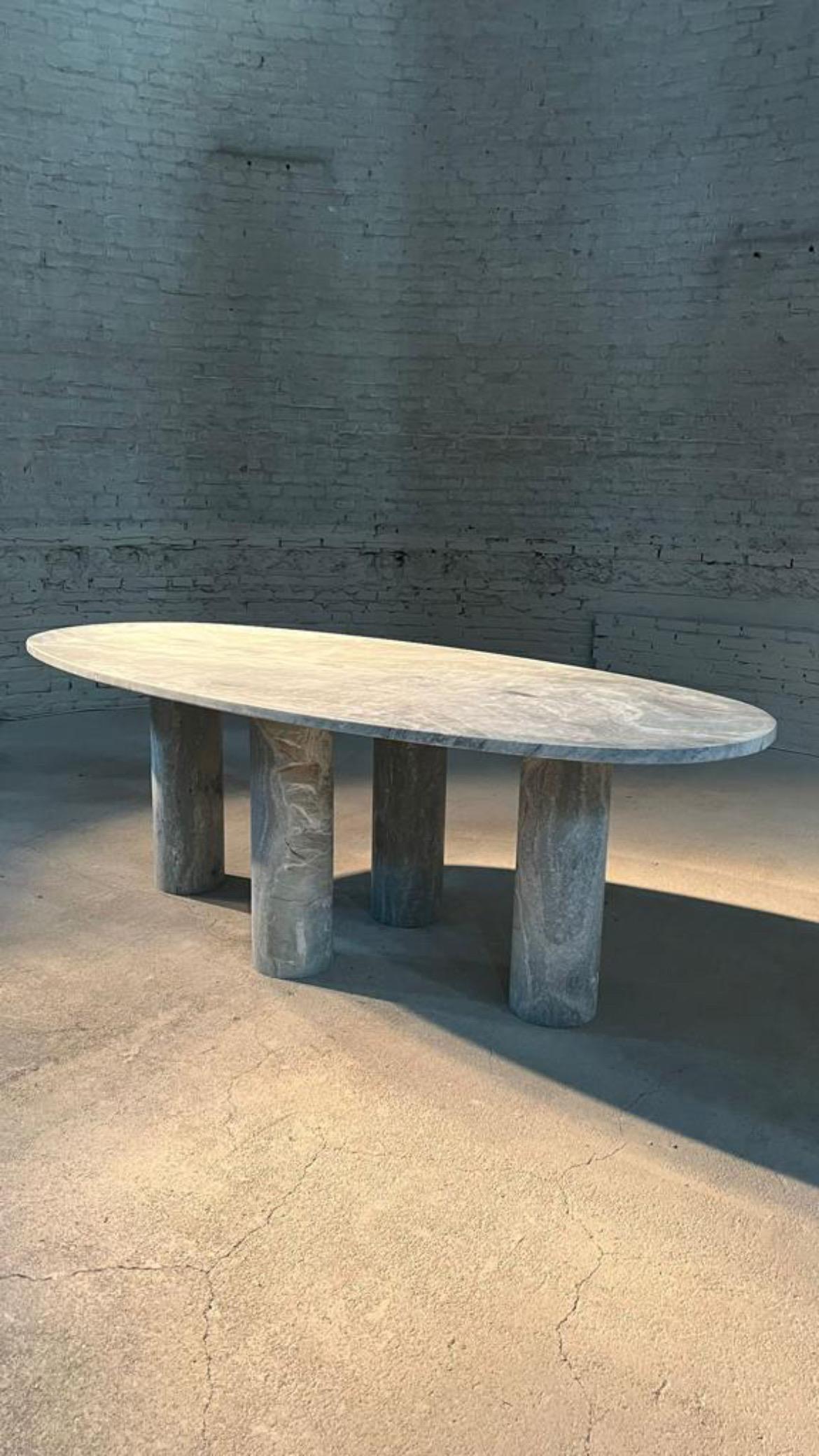 https://a.1stdibscdn.com/large-solid-stone-green-marble-oval-dining-table-with-bellini-style-column-legs-for-sale-picture-2/f_80522/f_324225721675952087471/1B6373E2_8807_4A1F_996F_7847C9198ED2_master.JPG