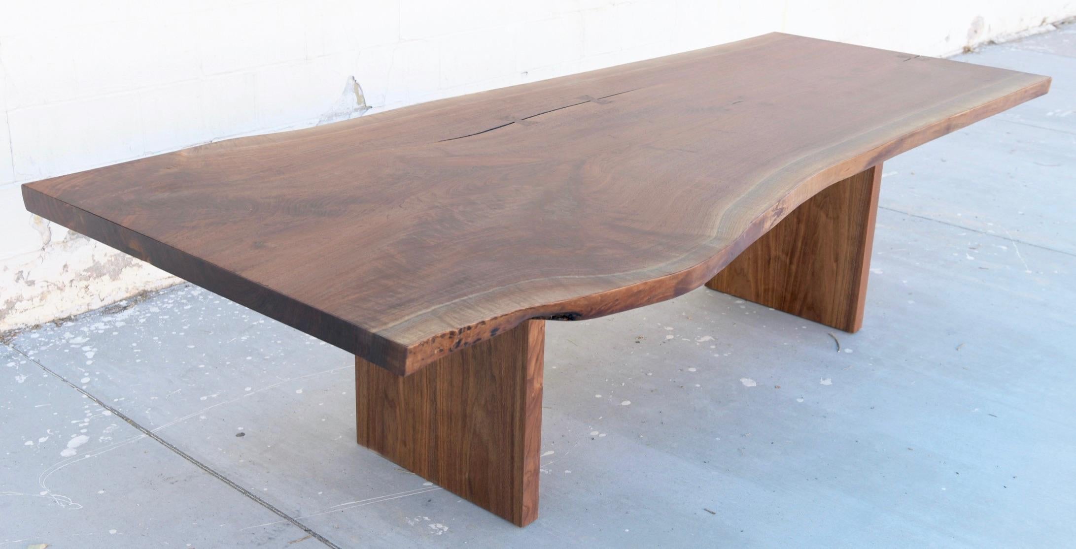https://a.1stdibscdn.com/walnut-slab-live-edge-dining-table-custom-made-by-petersen-antiques-for-sale-picture-2/f_8065/1597847491604/1ED198E0_67D5_4789_9A88_972A1A38CD68_master.jpeg