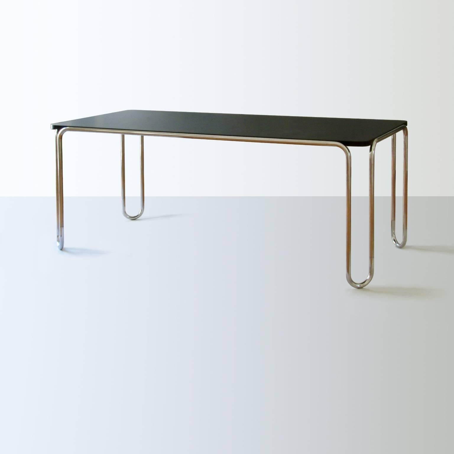 https://a.1stdibscdn.com/modernist-ultra-thin-table-chrome-plated-steel-veneered-wood-customizable-for-sale-picture-2/f_19723/f_466172821757584233663/1_MODERN_XX_GMD_Berlin_Stahlrohr_Schlaufentisch_Tubular_steel_table_master.jpg