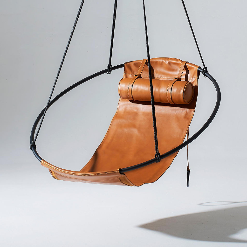 https://a.1stdibscdn.com/contemporary-genuine-leather-mild-steel-hanging-sling-chair-in-brown-ochre-for-sale-picture-2/f_32773/f_312695521668169568424/1_Sling_hanging_chair_swing_seat_OCHRE_master.jpg