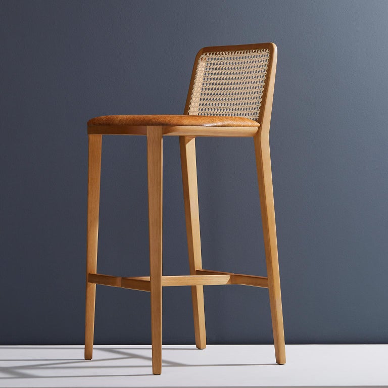 https://a.1stdibscdn.com/minimal-style-solid-wood-stool-bar-or-counter-hight-caning-and-leather-for-sale-picture-6/f_35593/f_197356321593808016304/2019_05_30_Emporio_DanielSimonini_0185_master.jpg?width=768