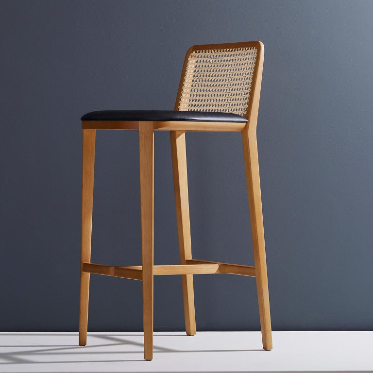 https://a.1stdibscdn.com/minimal-style-solid-wood-stool-bar-or-counter-hight-caning-and-leather-for-sale-picture-2/f_35593/f_197356321593808656132/2019_05_30_Emporio_DanielSimonini_0185_master.jpg?width=768