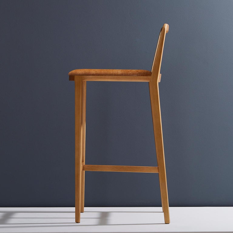 https://a.1stdibscdn.com/minimal-style-solid-wood-stool-bar-or-counter-hight-caning-and-leather-for-sale-picture-3/f_35593/f_197159821593721089705/2019_05_30_Emporio_DanielSimonini_0186_master.jpg?width=768