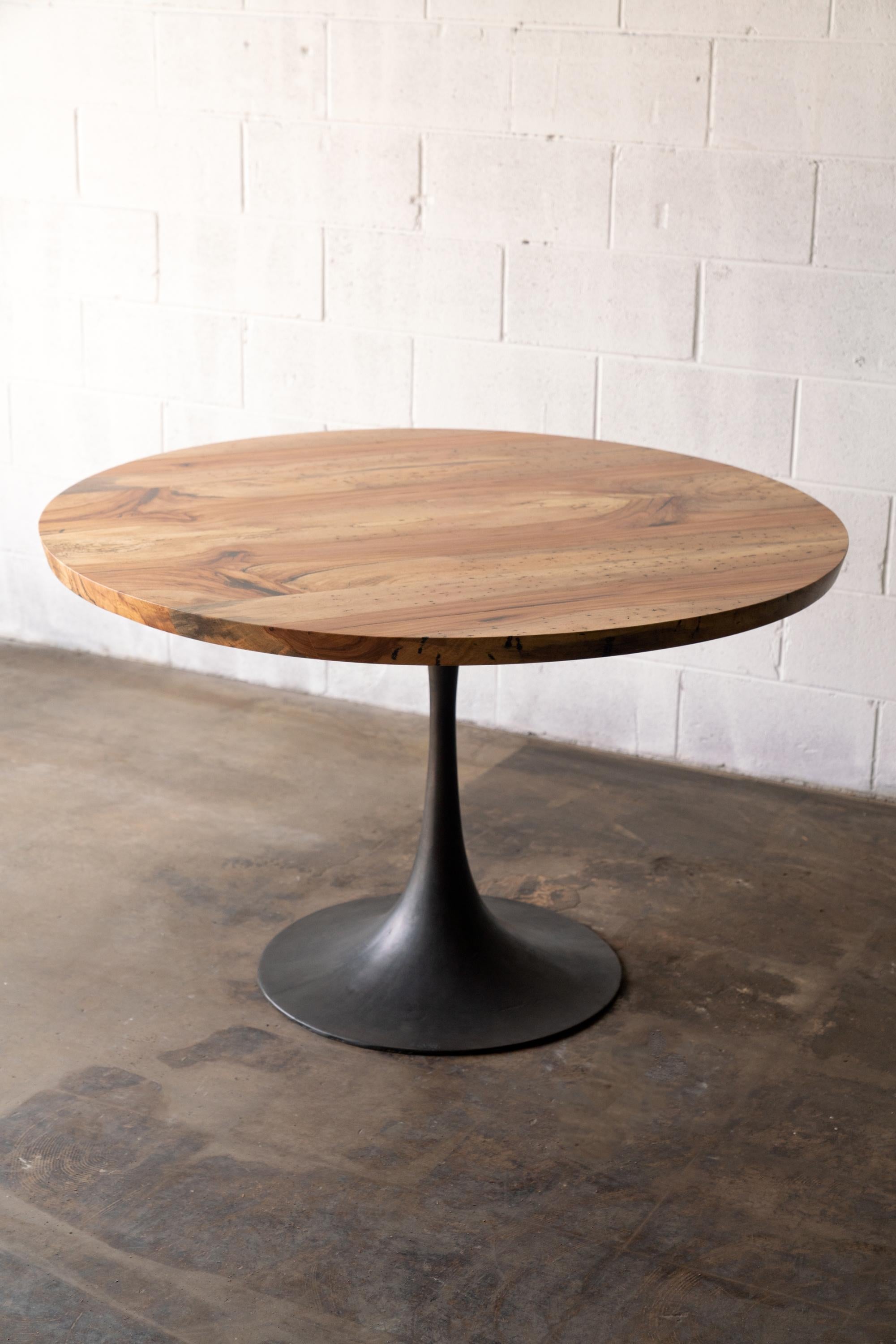 https://a.1stdibscdn.com/round-pedestal-base-dining-table-solid-pecan-wood-top-on-hand-cast-tulip-base-for-sale-picture-2/f_43982/f_203742621598633951948/2020_38_7R3_0137_3000px_master.jpg