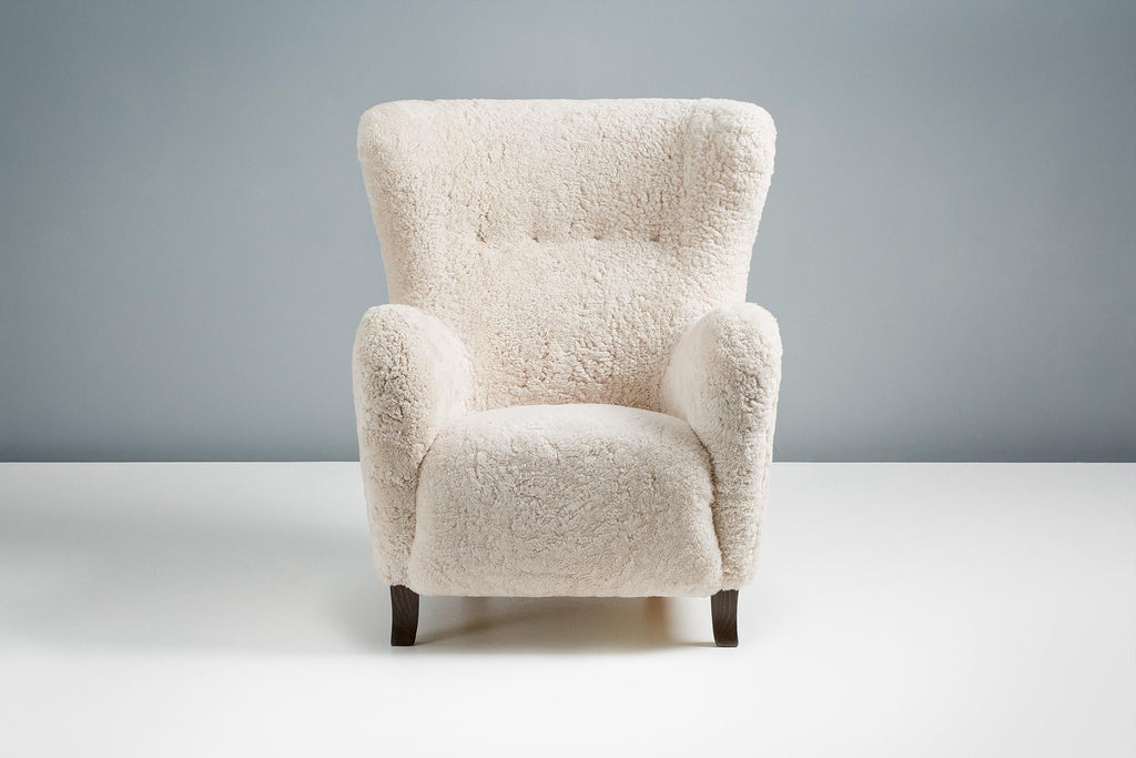 https://a.1stdibscdn.com/sheepskin-sampo-chair-ottoman-for-sale-picture-2/f_13332/f_362756921695381896847/20211011_Dagmar_Batch_0640125_r1_srgb_master.jpg