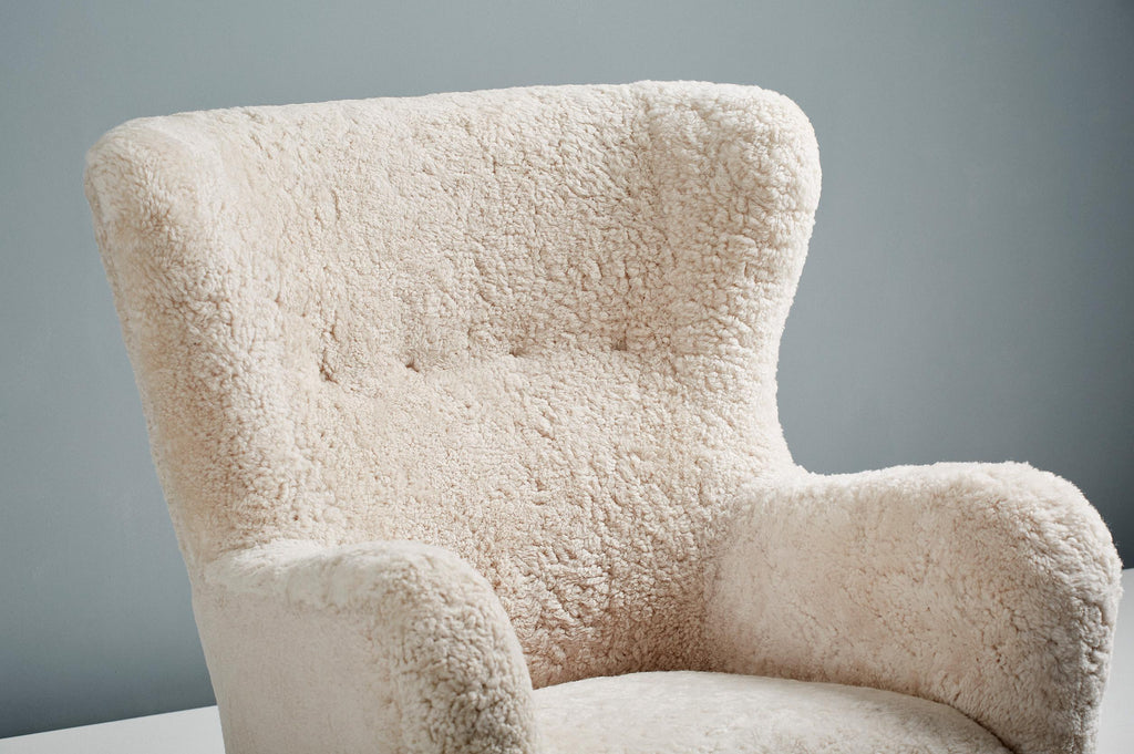 https://a.1stdibscdn.com/sheepskin-sampo-chair-ottoman-for-sale-picture-6/f_13332/f_362756921695381897971/20211011_Dagmar_Batch_0640127_r1_srgb_master.jpg