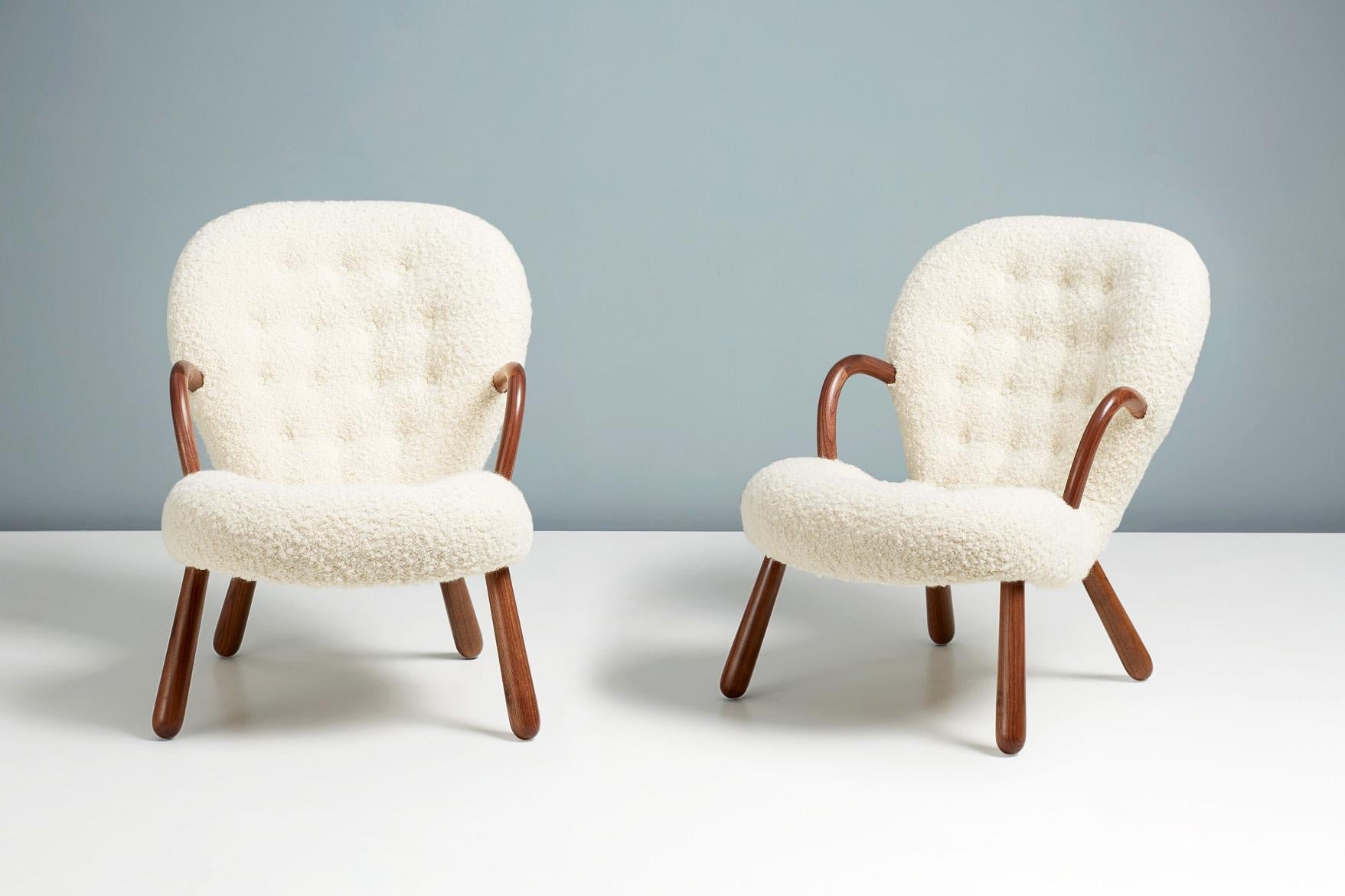 https://a.1stdibscdn.com/pair-of-arnold-madsen-boucle-clam-chairs-for-sale-picture-5/f_13332/f_291079421655219195080/20220504_DagmarFurniture_Batch_069_ArnoldMadsenDagmar_ClamChair_REPRO_Opio_WhiteWalnut_10_13PAIR_master.jpg