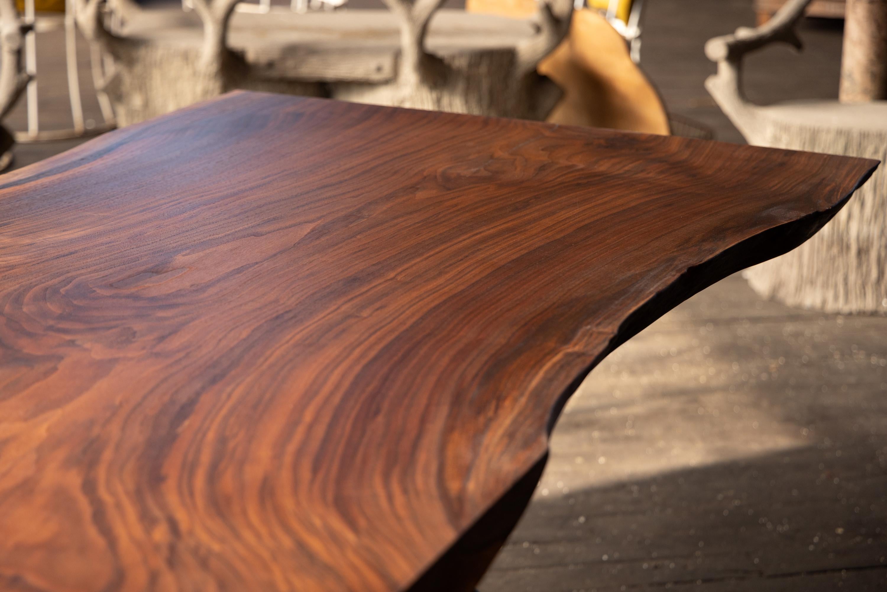 https://a.1stdibscdn.com/live-edge-walnut-table-hand-cast-black-steel-pedestal-base-for-sale-picture-3/f_43982/f_271682621643666361300/2022_05_R5_0223_3000px_master.jpg