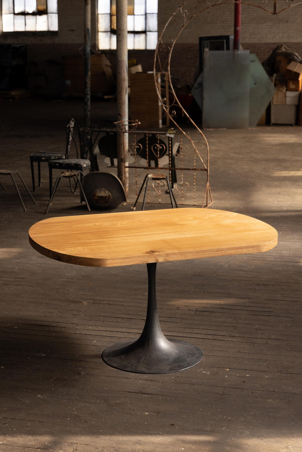 https://a.1stdibscdn.com/round-racetrack-pedestal-dining-table-white-oak-on-cast-iron-amicalola-base-for-sale-picture-5/f_43982/f_271684621643666957738/2022_05_R5_0271_3000px_master.jpg
