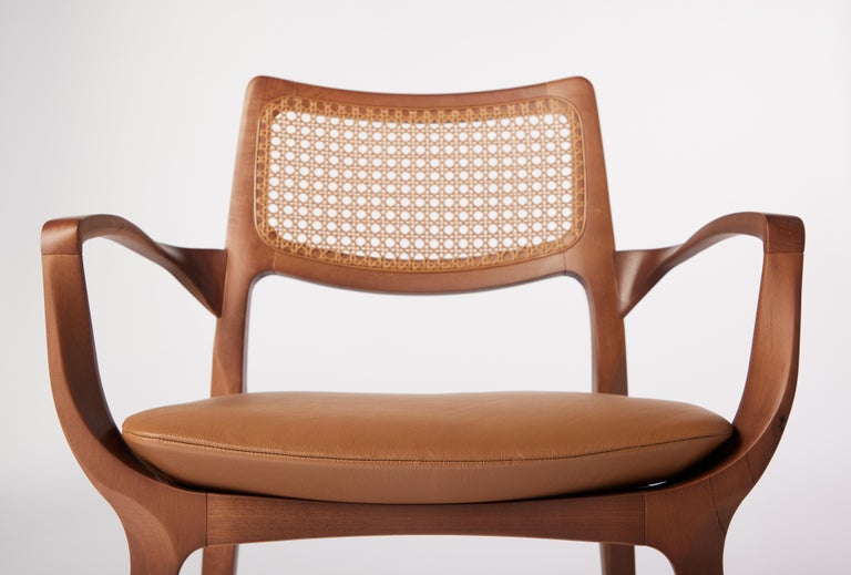 https://a.1stdibscdn.com/post-modern-style-aurora-chair-in-sculpted-walnut-finish-with-cane-and-leather-for-sale-picture-5/f_35593/f_299044221659978232057/2022_06_09_Daniel_Simonini20060_master.jpg?width=768