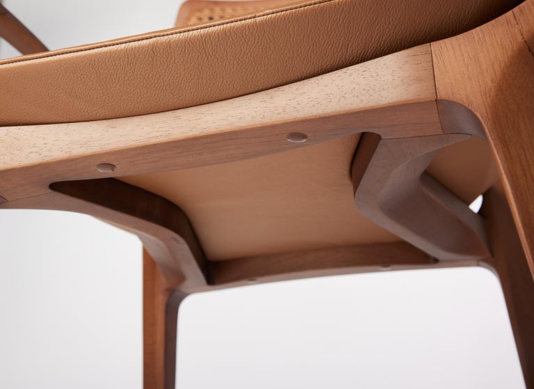 https://a.1stdibscdn.com/post-modern-style-aurora-chair-in-sculpted-walnut-finish-with-cane-and-leather-for-sale-picture-8/f_35593/f_299044221659978232127/2022_06_09_Daniel_Simonini20061_master.jpg?width=768
