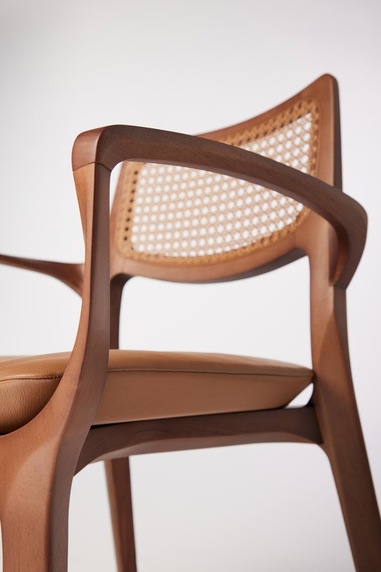 https://a.1stdibscdn.com/post-modern-style-aurora-chair-in-sculpted-walnut-finish-with-cane-and-leather-for-sale-picture-7/f_35593/f_299044221659978232628/2022_06_09_Daniel_Simonini20068_master.jpg?width=768