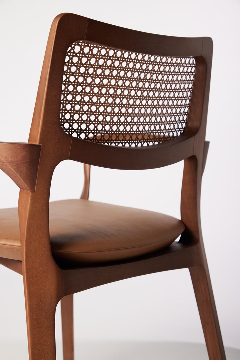 https://a.1stdibscdn.com/post-modern-style-aurora-chair-in-sculpted-walnut-finish-with-cane-and-leather-for-sale-picture-10/f_35593/f_299044221659978232519/2022_06_09_Daniel_Simonini20085_master.jpg?width=768