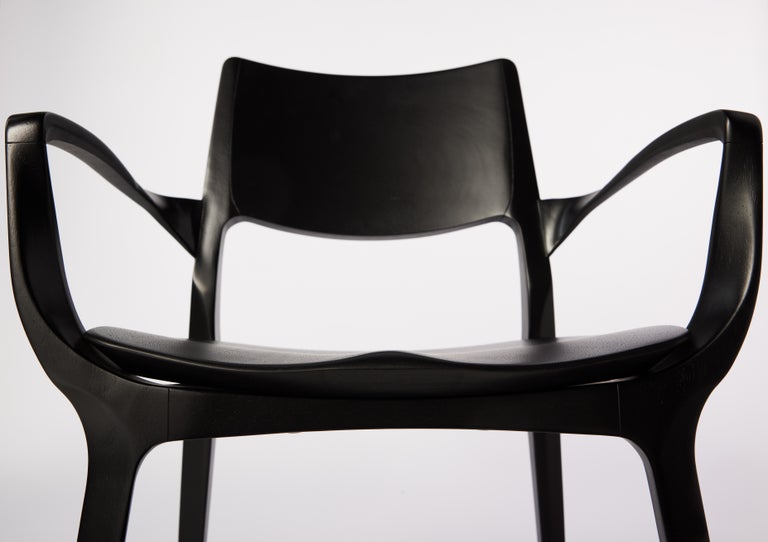 https://a.1stdibscdn.com/post-modern-style-aurora-chair-in-sculpted-black-ebonized-solid-wood-for-sale-picture-5/f_35593/f_299067221659985287394/2022_06_09_Daniel_Simonini20147_master.jpg?width=768