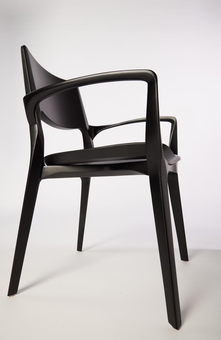 https://a.1stdibscdn.com/post-modern-style-aurora-chair-in-sculpted-black-ebonized-solid-wood-for-sale-picture-8/f_35593/f_299067221659985360794/2022_06_09_Daniel_Simonini20163_master.jpg?width=768
