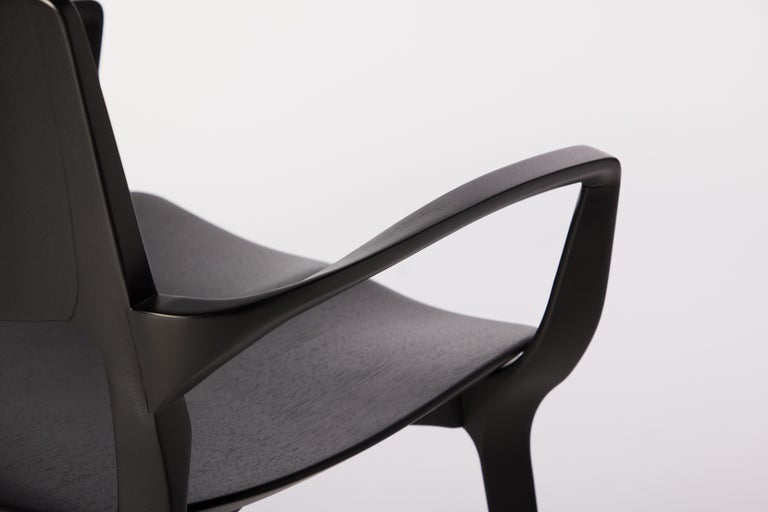 https://a.1stdibscdn.com/post-modern-style-aurora-chair-in-sculpted-black-ebonized-solid-wood-for-sale-picture-6/f_35593/f_299067221659985322463/2022_06_09_Daniel_Simonini20166_master.jpg?width=768