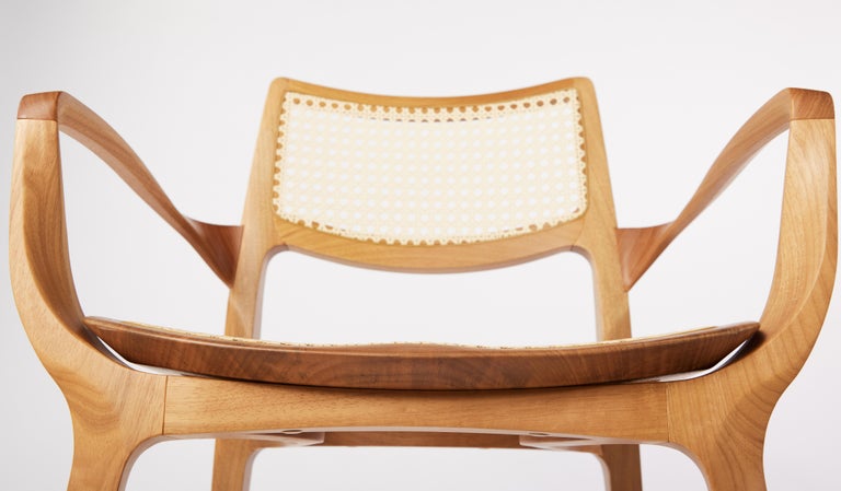 https://a.1stdibscdn.com/post-modern-style-aurora-chair-in-sculpted-solid-wood-with-cane-back-and-leather-for-sale-picture-5/f_35593/f_299051321659978935482/2022_06_09_Daniel_Simonini20275_master.jpg?width=768