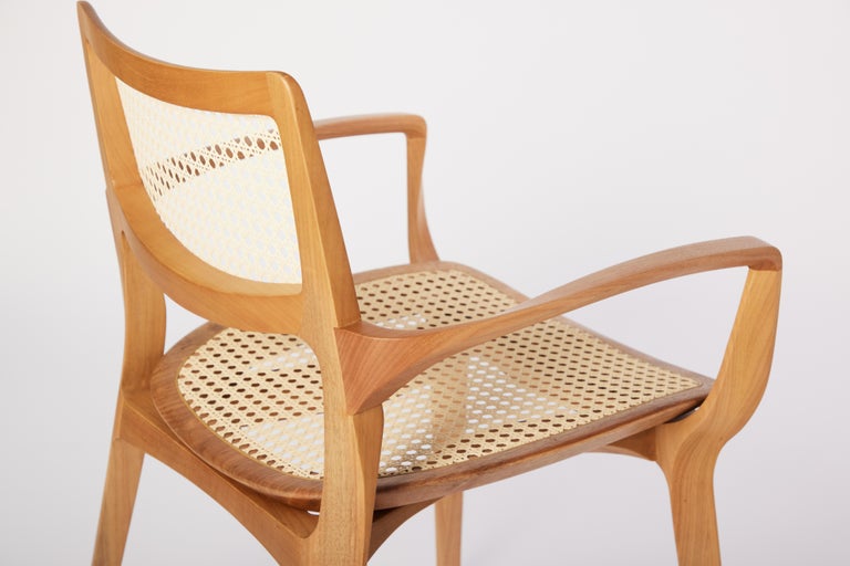 https://a.1stdibscdn.com/post-modern-style-aurora-chair-in-sculpted-solid-wood-with-cane-back-and-leather-for-sale-picture-9/f_35593/f_299051321659978993729/2022_06_09_Daniel_Simonini20291_master.jpg?width=768