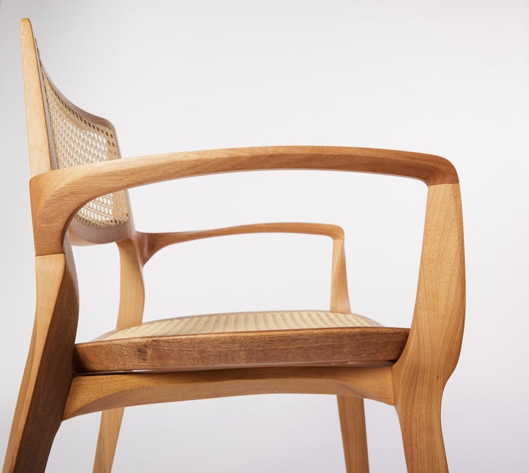 https://a.1stdibscdn.com/post-modern-style-aurora-chair-in-sculpted-solid-wood-with-cane-back-and-leather-for-sale-picture-6/f_35593/f_299051321659978881726/2022_06_09_Daniel_Simonini20294_master.jpg?width=768