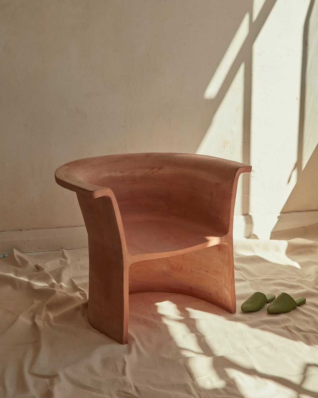https://a.1stdibscdn.com/new-volumes-terracotta-cove-chair-by-thomas-coward-for-sale-picture-2/f_78752/f_323641821674453421495/2022_NewVolumes_009_master.jpg