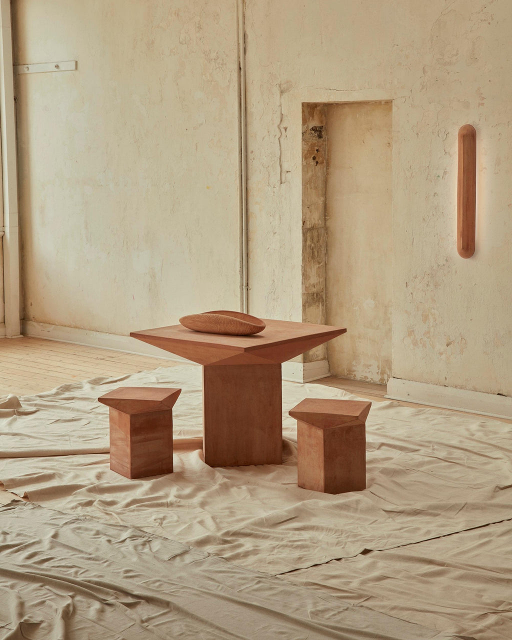 https://a.1stdibscdn.com/new-volumes-terracotta-pitcher-stool-by-adam-goodrum-for-sale-picture-5/f_78752/f_323634621674445968085/2022_NewVolumes_069_Lights_on_master.jpg