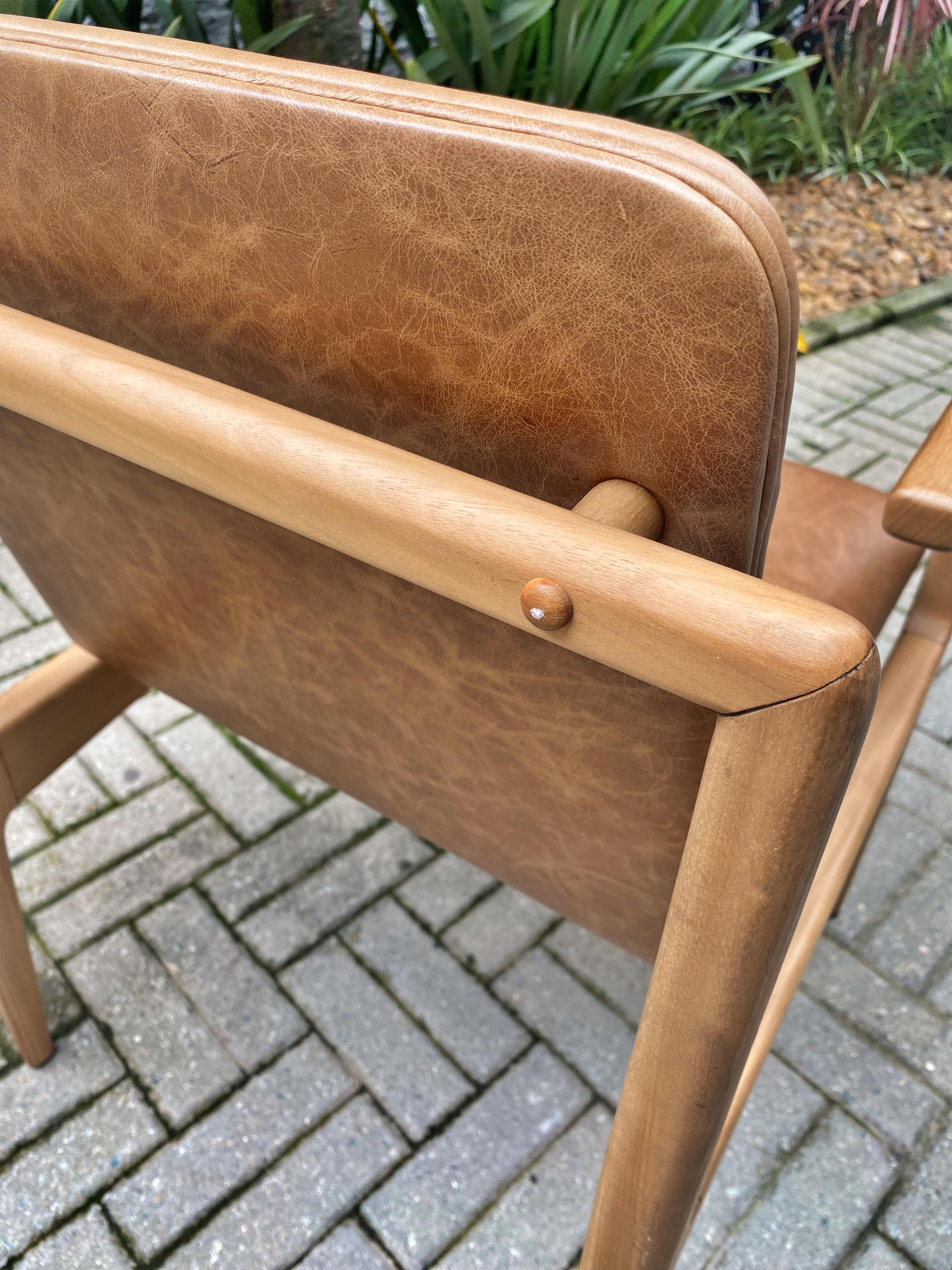 https://a.1stdibscdn.com/oscar-minimalist-chair-with-arms-in-solid-jequitiba-wood-and-natural-leather-for-sale-picture-11/f_33041/f_150167521698772419326/20231031_153939214_iOS_master.jpg