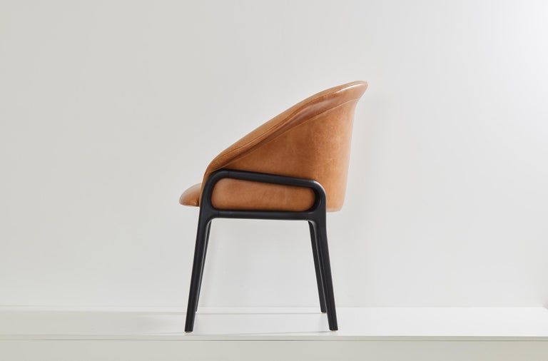https://a.1stdibscdn.com/minimalist-organic-chair-in-black-solid-wood-camel-leather-seating-tone-for-sale-picture-3/f_35593/f_389190621710882650868/2023_07_05_Simonini8824_master.jpg?width=768