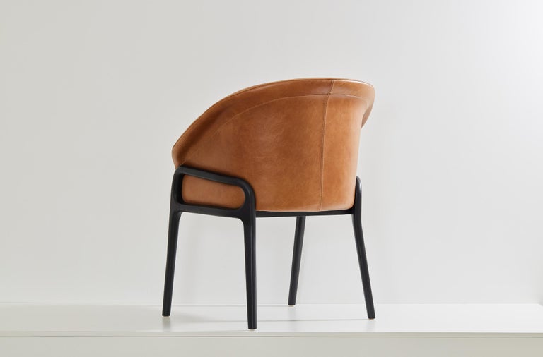 https://a.1stdibscdn.com/minimalist-organic-chair-in-black-solid-wood-camel-leather-seating-tone-for-sale-picture-4/f_35593/f_389190621710882651204/2023_07_05_Simonini8826_master.jpg?width=768